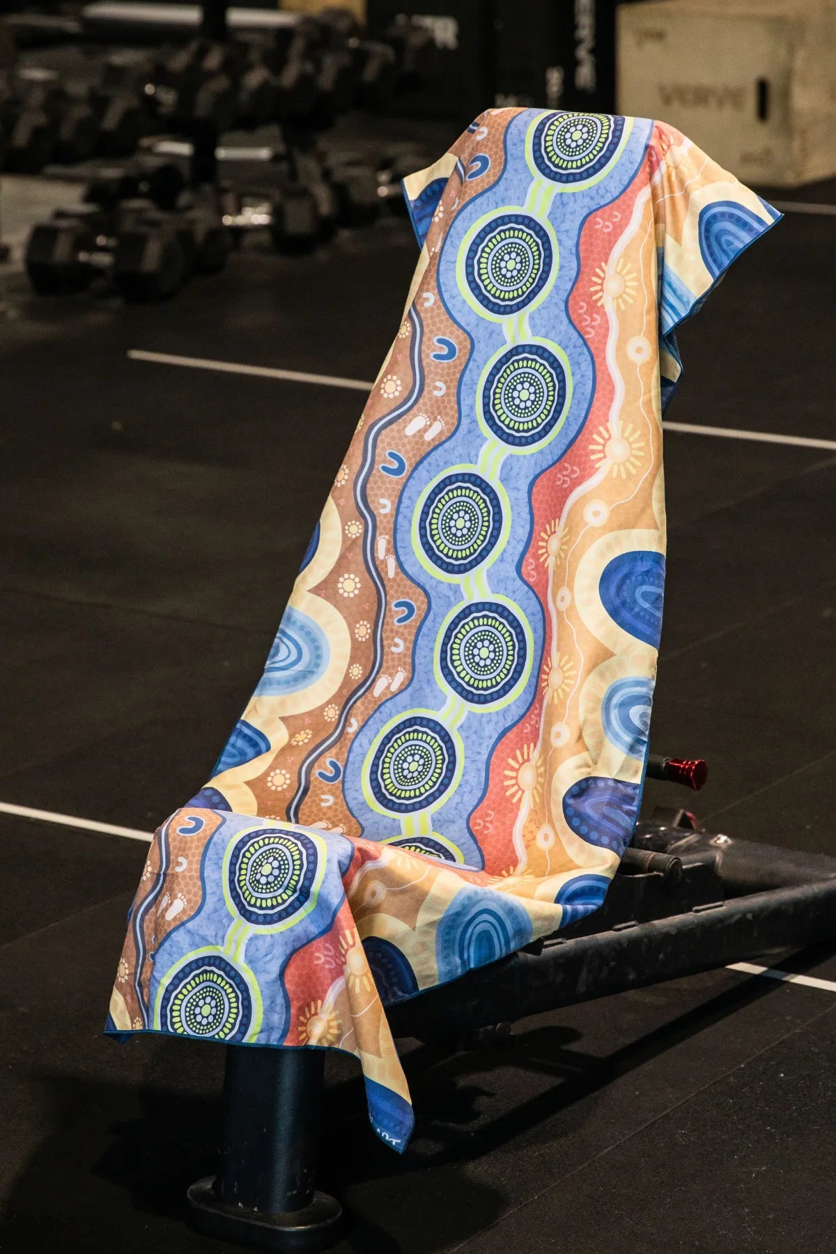 Calm Mind Indigenous hooded gym towel by Aboriginal artist Mirii Art, 140x60cm with zip pocket in hood, stays on gym bench, quick-dry and odour resistant by Cheeky Winx Australia.