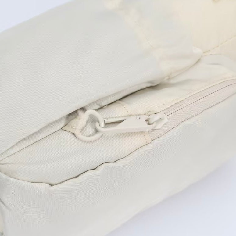 Cream water bottle bag with anti-theft zips and hidden passport pocket by Cheeky Winx
